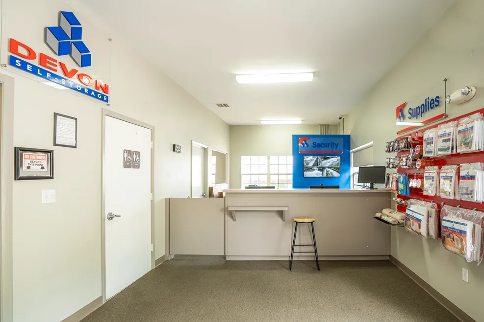 Self storage office with customer service desk and moving supplies